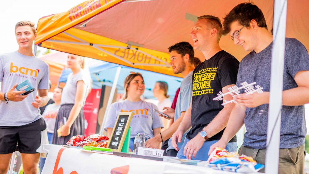 Students at a booth for Gobblerfest